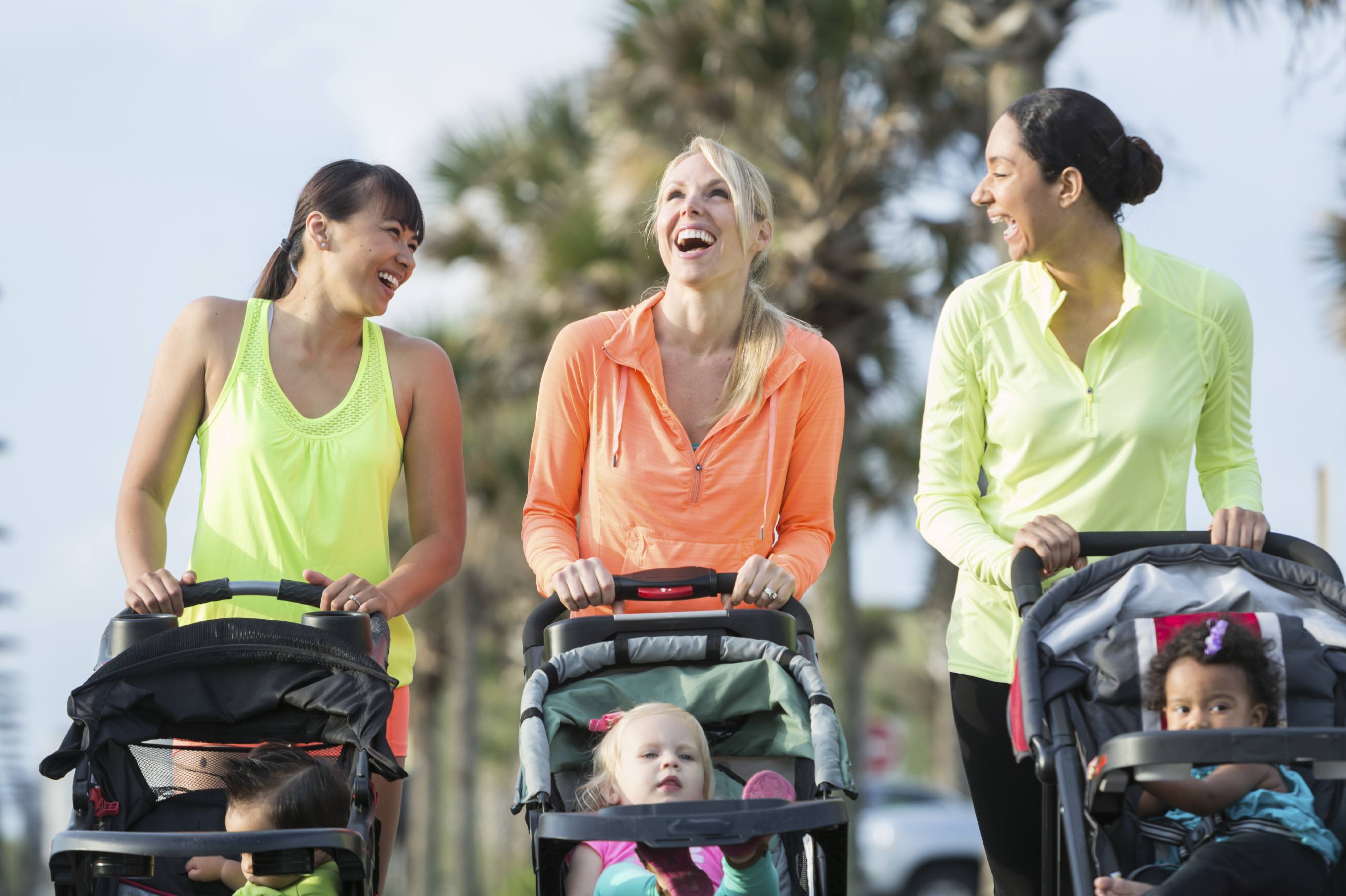 New mom friends. Mom pushing the girl in the Stroller.